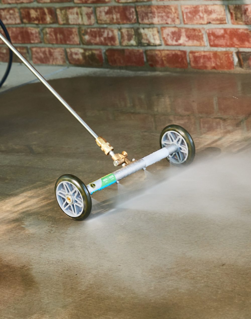 Cleaning a patio with a water broom